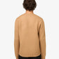 Beige sweater with 'A.P.C.' branding on a light gray background