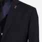 Black suit jacket with a gold emblem on a light gray background