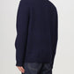 Navy blue sweater with A.P.C. branding on a white background