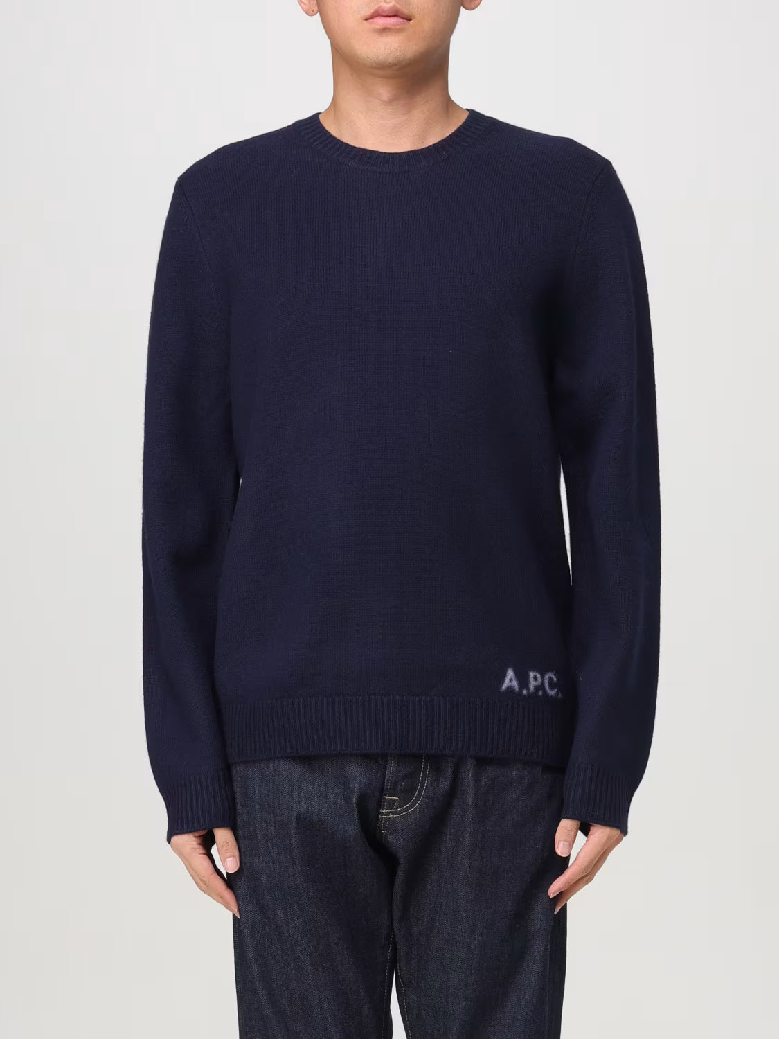 Navy blue sweater with A.P.C. branding on a white background
