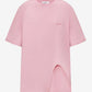A light pink short-sleeve t-shirt with a small tonal pink ATTICO' logo on the left chest, displayed on a neutral light gray background.