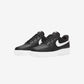 Black sneakers with a white logo on a light gray background
