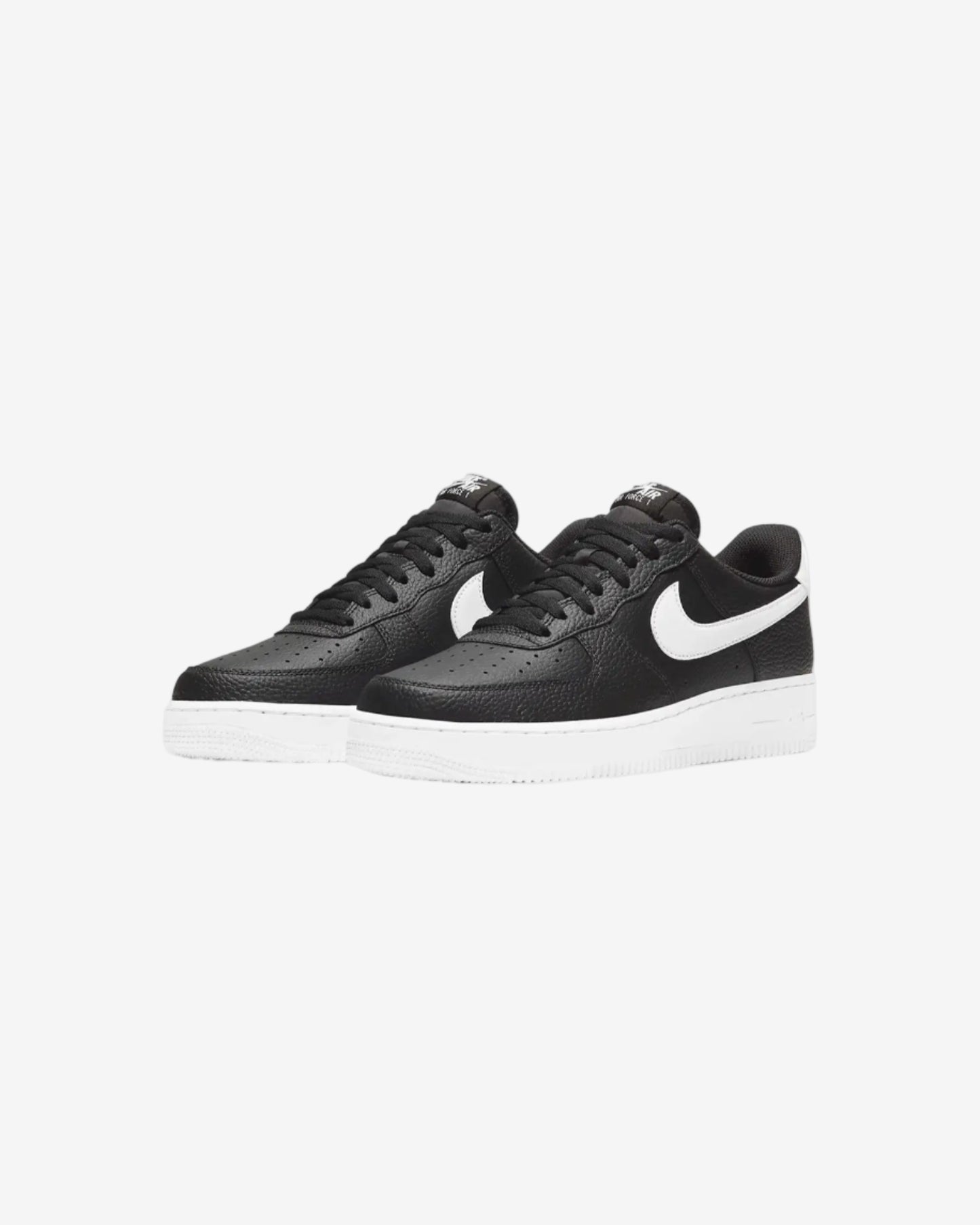 Black sneakers with a white logo on a light gray background