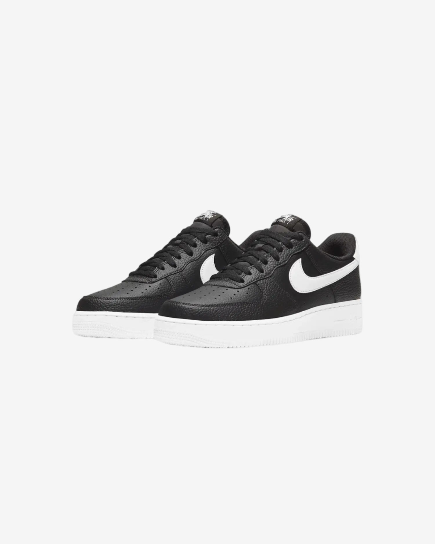 Black sneakers with a white logo on a light gray background