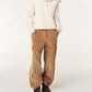 Person wearing a cream hoodie and tan cargo pants on a white background