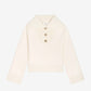 Cream-colored blazer with buttons on a white background