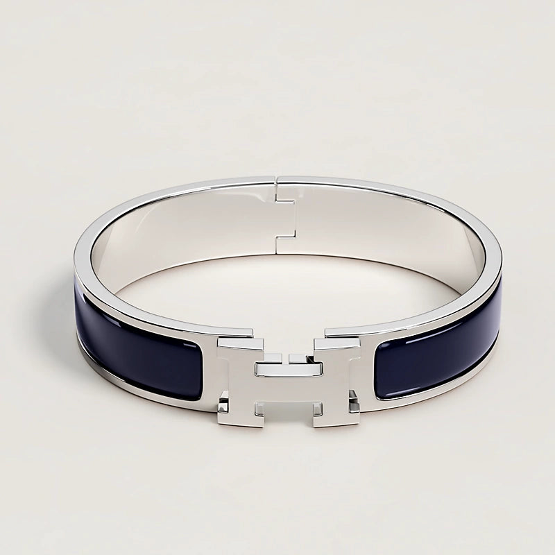 Silver bracelet with blue accents on a light gray background