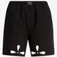 Black shorts with cut-out designs on a white background