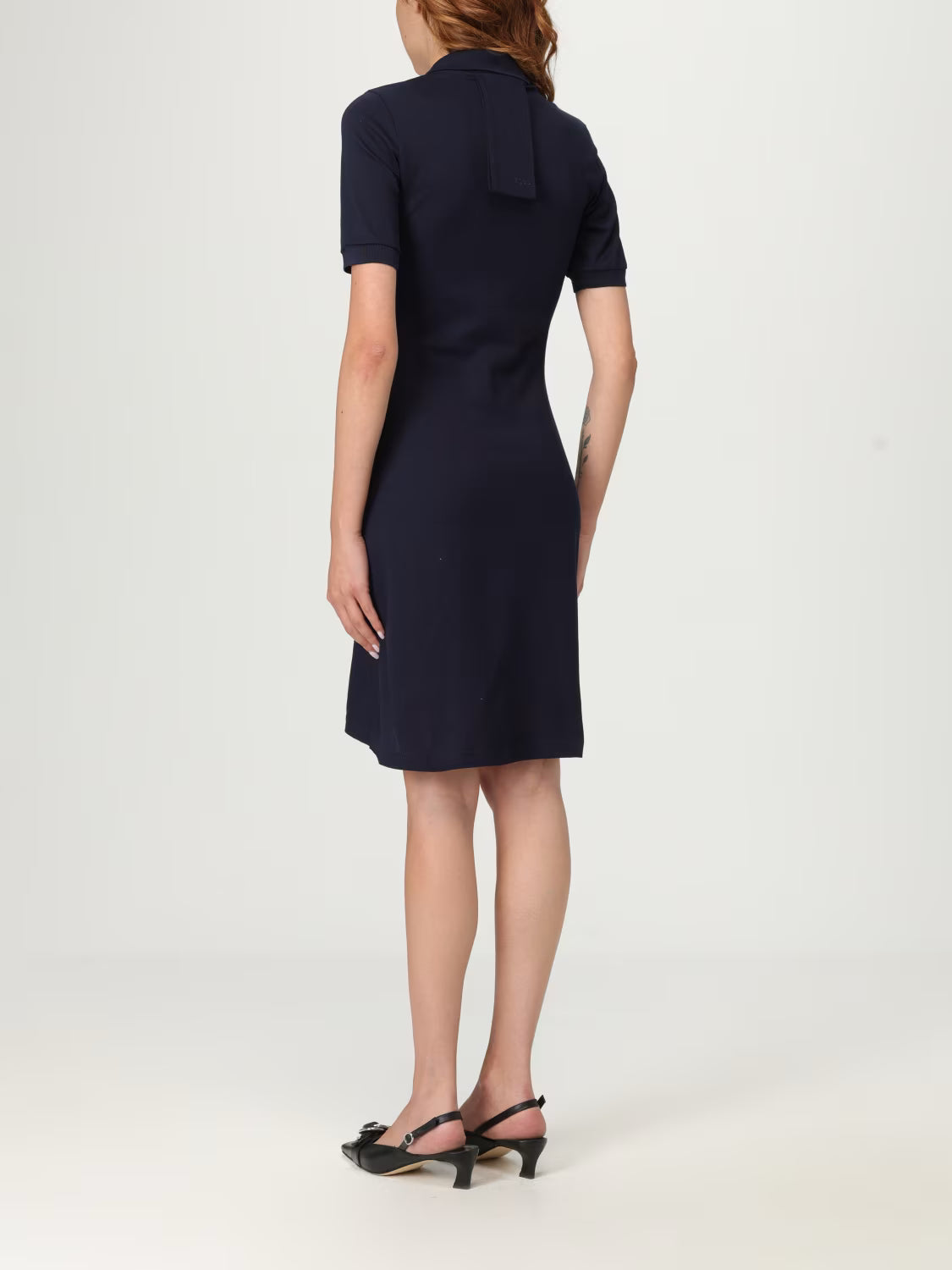 Navy blue dress with a collar on a white background