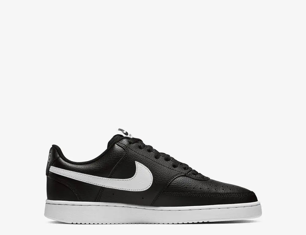 Black sneaker with white swoosh logo on a white background
