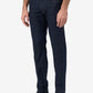 Person wearing dark blue jeans on a white background