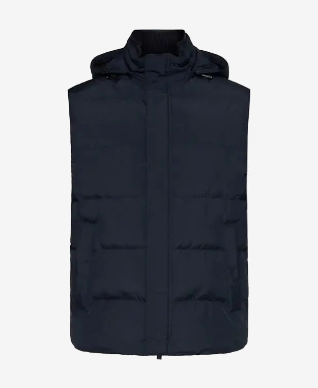 Black puffer vest on a white background