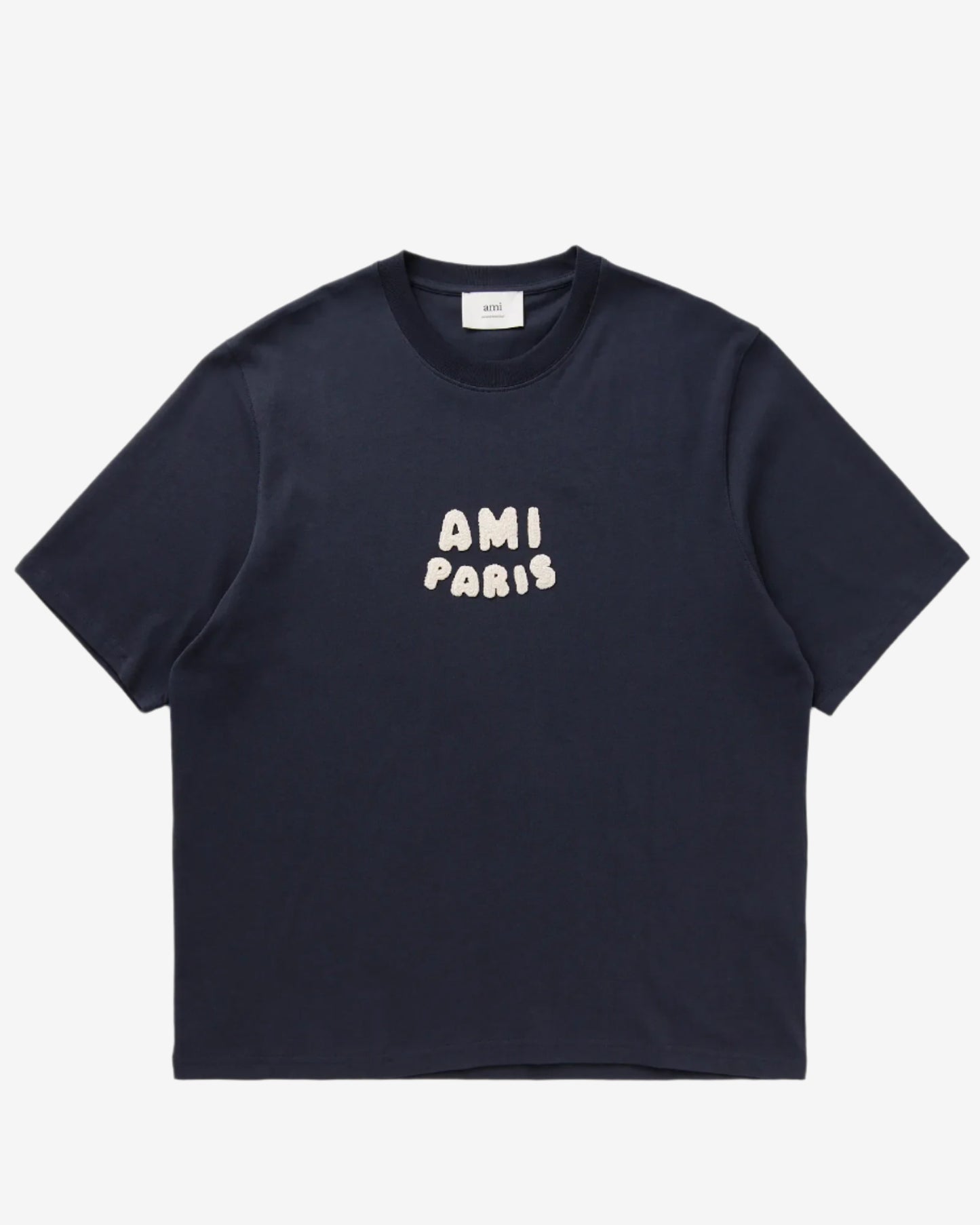Navy blue t-shirt with 'AMI PARIS' text on a light gray background