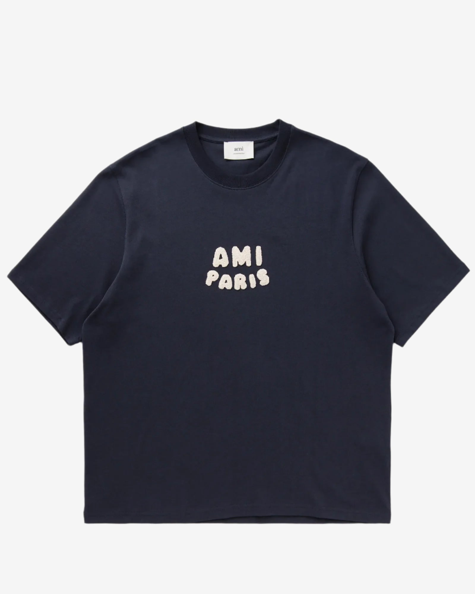 Navy blue t-shirt with 'AMI PARIS' text on a light gray background