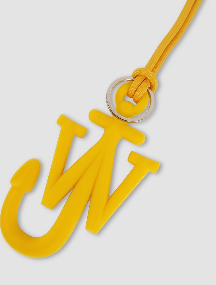 Yellow pendant with a unique design on a light gray background