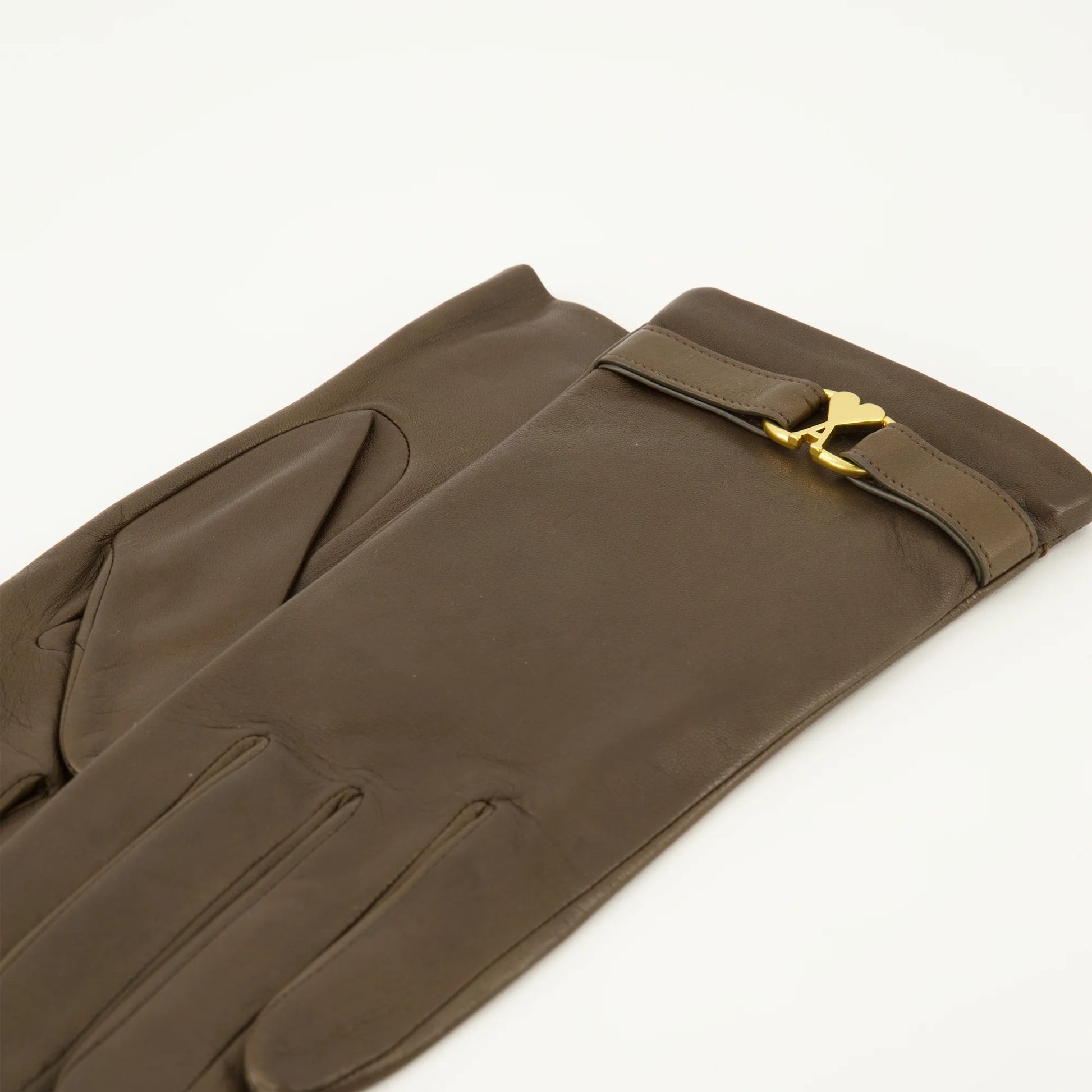 Pair of brown gloves with gold logo on a white background AMI PARIS
