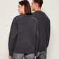 Dark gray cardigan with a red heart emblem on a beige background ami paris
