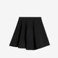 Black skirt on a light beige background