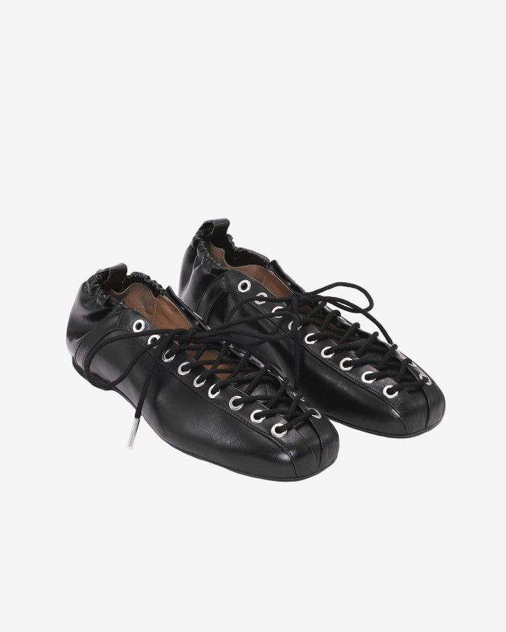 Pair of black leather shoes with laces on a white background
