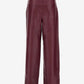 Maroon leather pants on a white background