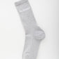 Grey sock with 'Jacquemus' branding on a white background