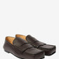 Pair of brown loafers on a light gray background