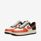 Pair of sneakers with black, white, and red design on a light gray background
