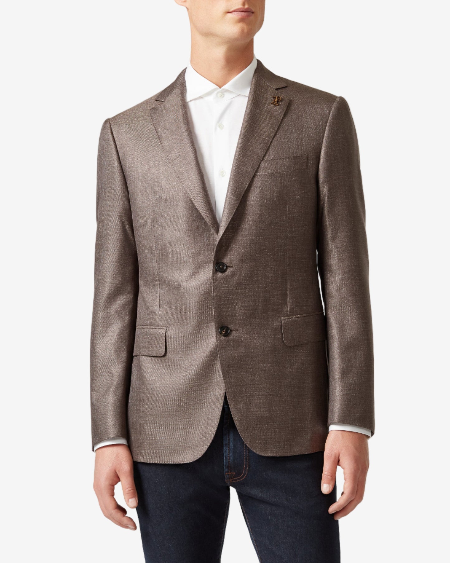 Man wearing a brown blazer over a white shirt on a light gray background