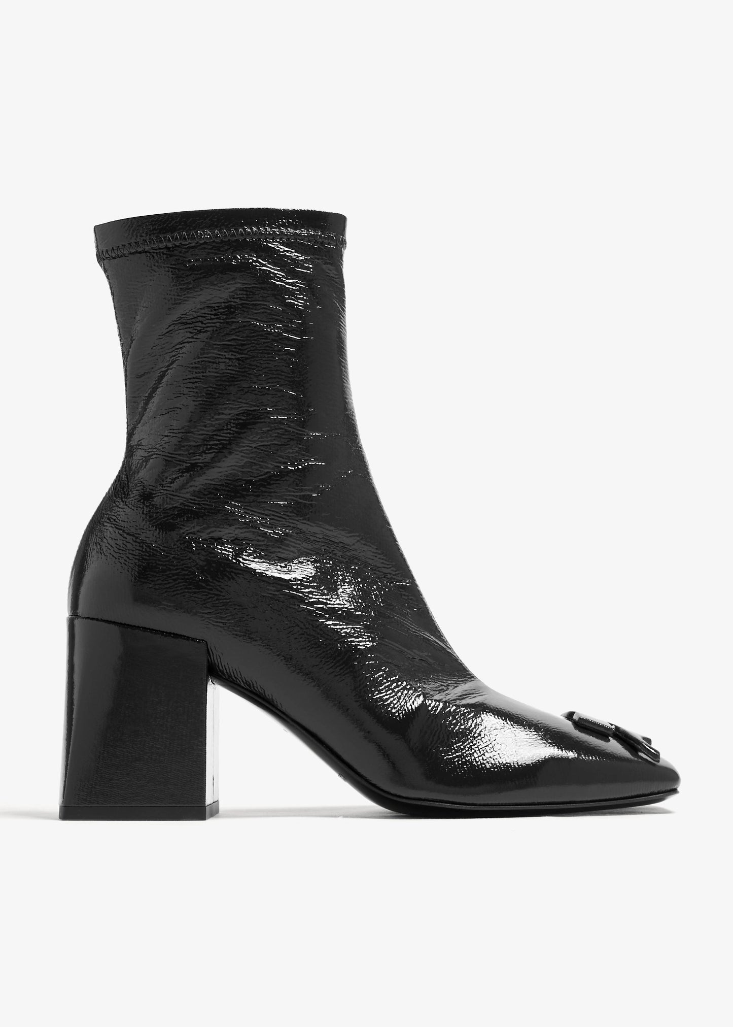 Black ankle boot with block heel on a white background