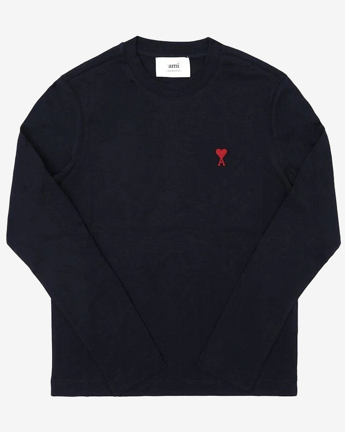 Black long-sleeve shirt with a red heart design on a white background