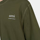 Green t-shirt with a small logo on a white background ami paris