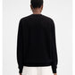 Black sweatshirt with a small white logo on a white background