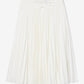 White pleated skirt on a gray background